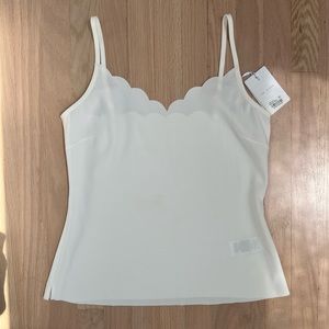 Scalloped white tank